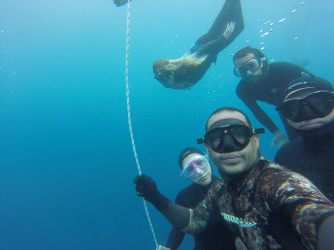 People freediving in the sea